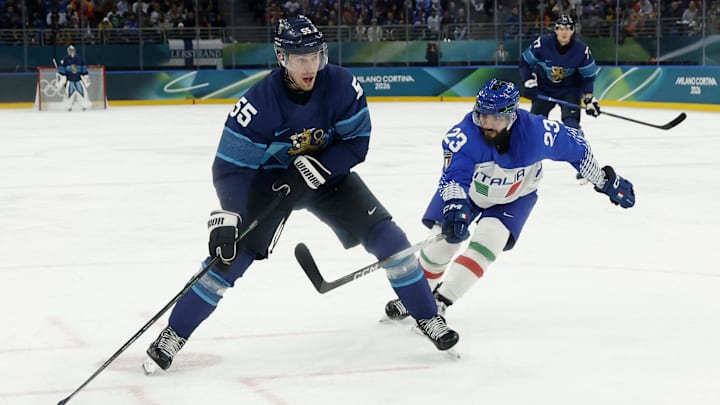 Feb 14, 2026; Milan, Italy; Rasmus Ristolainen of Finland in action with Giovanni Morini of Italy in men's ice hockey group B play during the Milano Cortina 2026 Olympic Winter Games at Milano Santagiulia Ice Hockey Arena. Mandatory Credit: Geoff Burke-Imagn Images Feb 14, 2026; Milan, Italy; Rasmus Ristolainen of Finland in action with Giovanni Morini of Italy in men's ice hockey group B play during the Milano Cortina 2026 Olympic Winter Games at Milano Santagiulia Ice Hockey Arena. Mandatory Credit: Geoff Burke-Imagn Images