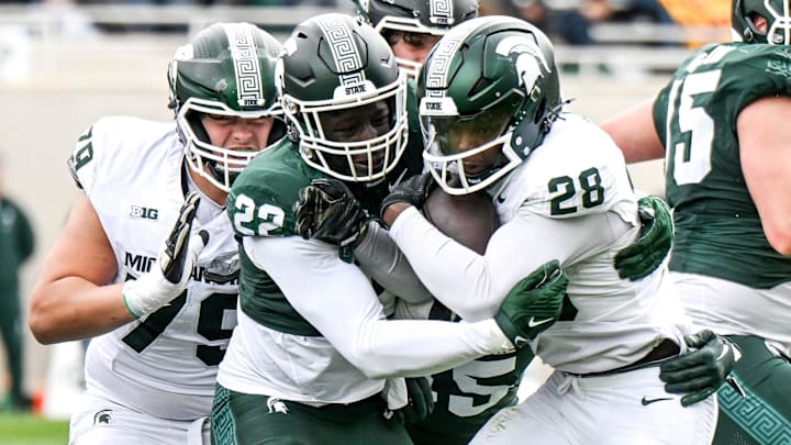 Michigan State's Bai Jobe, left, tackles Brandon Tullis during the Spring Showcase on Saturday, April 20, 2024, at Spartan Stadium in East Lansing.