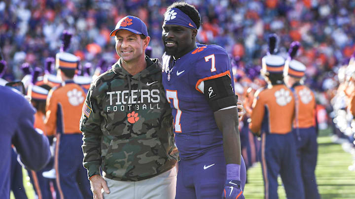 Nov 23, 2024; Clemson, South Carolina, USA; Clemson Tigers head coach Dabo Swinney stands with running back Phil Mafah (7) as each senior is introduced on Senior Day before a game against The Citadel Bulldogs at Memorial Stadium. Nov 23, 2024; Clemson, South Carolina, USA; Clemson Tigers head coach Dabo Swinney stands with running back Phil Mafah (7) as each senior is introduced on Senior Day before a game against The Citadel Bulldogs at Memorial Stadium.