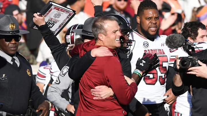 Nov 30, 2024; Clemson, South Carolina, USA; Clemson head coach Dabo Swinney and South Carolina Head Coach Shane Beamer talk after the game at Memorial Stadium. Mandatory Credit: Ken Ruinard-Imagn Images