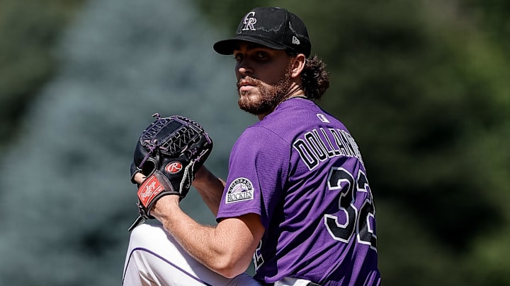 Colorado Rockies starting pitcher Chase Dollander (32) pitches.