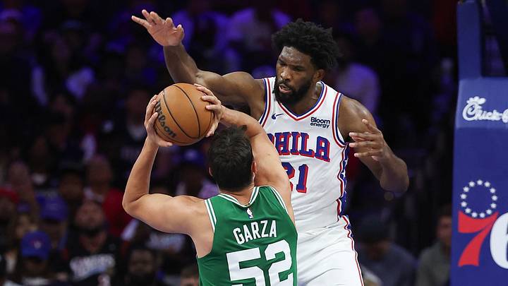 Oct 16, 2026; Philadelphia, Pennsylvania, USA; Boston Celtics center Luka Garza (52) is fouled while shooting against Philadelphia 76ers center Joel Embiid (21) during the second quarter at Xfinity Mobile Arena. Mandatory Credit: Bill Streicher-Imagn Images Oct 16, 2026; Philadelphia, Pennsylvania, USA; Boston Celtics center Luka Garza (52) is fouled while shooting against Philadelphia 76ers center Joel Embiid (21) during the second quarter at Xfinity Mobile Arena. Mandatory Credit: Bill Streicher-Imagn Images