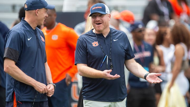 Auburn Tigers defensive coordinator D.J. Durkin and head coach Alex Golesh talk during warm ups before Auburn Tigers A-Day spring game at Jordan-Hare Stadium in Auburn, Ala. on Saturday, April 18, 2026.