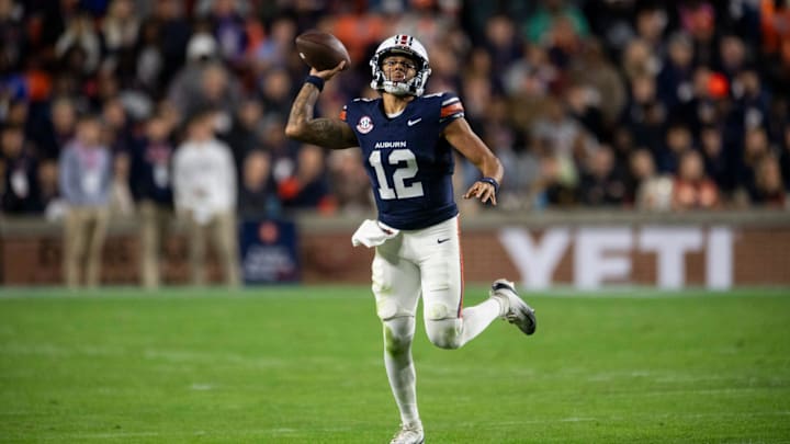 Auburn Tigers quarterback Ashton Daniels (12) pump fakes a pass as Auburn Tigers take on Kentucky Wildcats at Jordan-Hare Stadium in Auburn, Ala. on Saturday, Nov. 1, 2025. Auburn Tigers and Kentucky Wildcats are tied 3-3 at halftime.