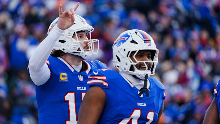 Buffalo Bills quarterback Josh Allen signals they are going for the two-point conversion during the second half of the Buffalo Bills wild card game against the Denver Broncos at Highmark Stadium in Orchard Park on Jan. 12, 2025. Smiling about the touchdown is Buffalo Bills fullback Reggie Gilliam.