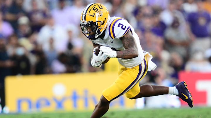 Sep 4, 2021; Pasadena, California, USA; Louisiana State Tigers wide receiver Koy Moore (2) runs the ball against the UCLA Bruins during the first half the at the Rose Bowl. Mandatory Credit: Gary A. Vasquez-Imagn Images