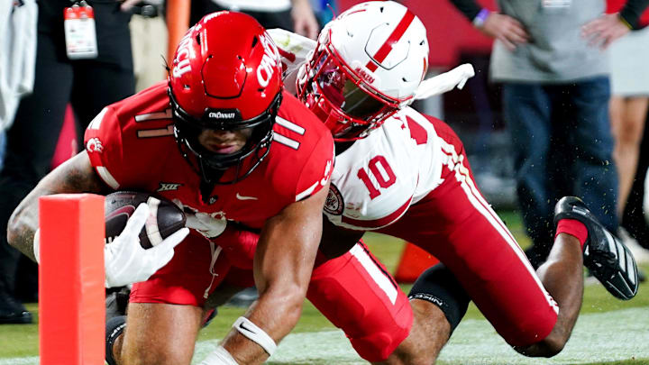 DUPLICATE***Cincinnati Bearcats tight end Joe Royer (11) catches a pass before being tackled by Nebraska Cornhuskers defensive back Andrew Marshall (10) in the fourth quarter of the Kansas City Classic season opening game between the Cincinnati Bearcats and Nebraska Cornhuskers, Aug. 28, 2025, at Arrowhead Stadium in Kansas City, Mo. Cornhuskers won 20-17.