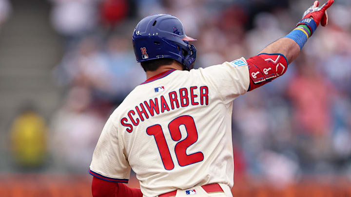 Aug 20, 2025; Philadelphia, Pennsylvania, USA; Philadelphia Phillies outfielder Kyle Schwarber (12) runs the bases after hitting a two RBI home run during the eighth inning against the Seattle Mariners at Citizens Bank Park. Mandatory Credit: Bill Streicher-Imagn Images