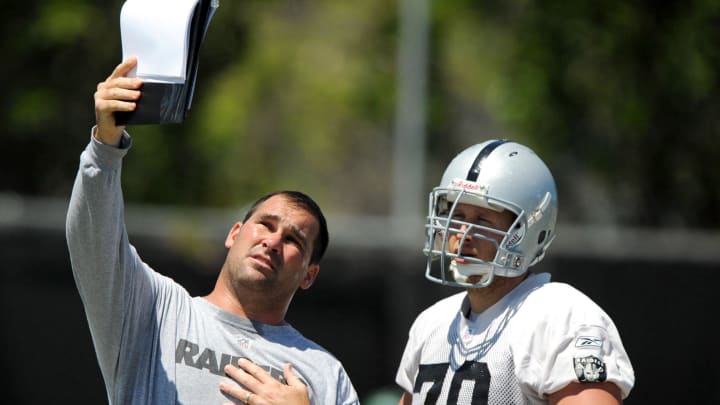 Jun 4, 2008; Alameda, CA, USA: Oakland Raiders assistant offensive line coach James Cregg displays a formation to center Jesse Boone (70) during minicamp at the Raiders practice facility. Mandatory Credit: Kirby Lee/Image of Sport-USA TODAY Sports Jun 4, 2008; Alameda, CA, USA: Oakland Raiders assistant offensive line coach James Cregg displays a formation to center Jesse Boone (70) during minicamp at the Raiders practice facility. Mandatory Credit: Kirby Lee/Image of Sport-USA TODAY Sports