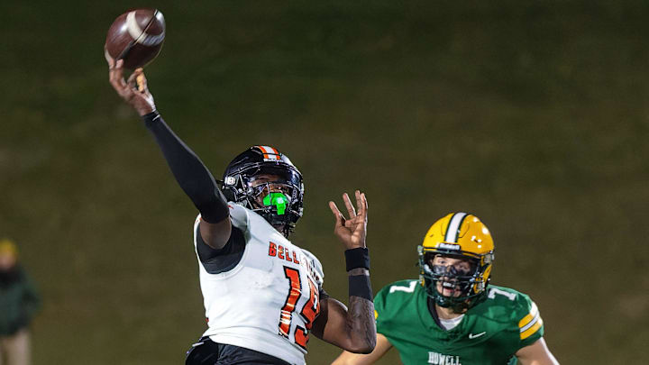 Howell's Brody Stack (7) attempts to run down Belleville's Bryce Underwood Friday, Oct. 25, 2024.