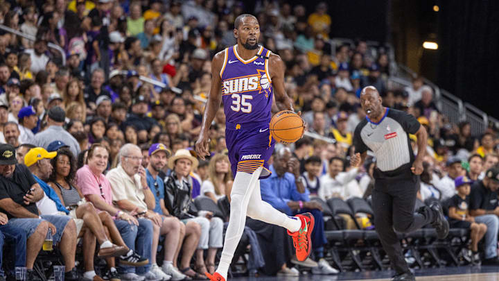 Oct 6, 2024; Palm Desert, California, USA; Phoenix Suns forward Kevin Durant (35) moves the ball against the Los Angeles Lakers during the first half at Acrisure Arena. Mandatory Credit: David Frerker-Imagn Images