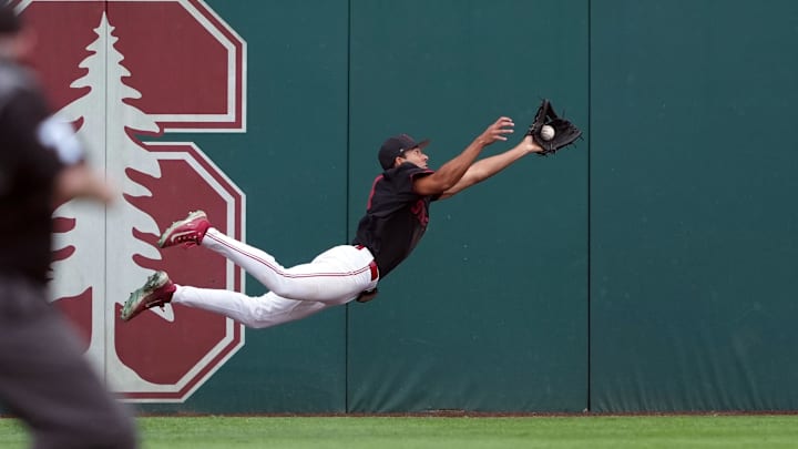 Mar 1, 2025; Stanford, CA, USA; Stanford Cardinal left fielder Tatum Marsh (4) catches a fly ball against the Xavier Musketeers during the eighth inning at Sunken Diamond. Mandatory Credit: Darren Yamashita-Imagn Images