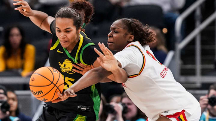 Oregon Ducks forward Ehis Etute (35) and Maryland Terrapins forward Isimenme Ozzy-Momodu (9) go for the ball Thursday, March 5, 2026, during a Big Ten women's basketball tournament game at Gainbridge Fieldhouse in Indianapolis. Ozzy-Momodu committed to Oklahoma on Thursday.
