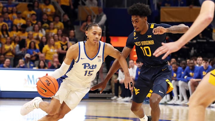 Nov 15, 2024; Pittsburgh, Pennsylvania, USA; Pittsburgh Panthers guard Jaland Lowe (15) drives to the basket against West Virginia Mountaineers center Eduardo Andre (0) during the first half at the Petersen Events Center. Mandatory Credit: Charles LeClaire-Imagn Images Nov 15, 2024; Pittsburgh, Pennsylvania, USA; Pittsburgh Panthers guard Jaland Lowe (15) drives to the basket against West Virginia Mountaineers center Eduardo Andre (0) during the first half at the Petersen Events Center. Mandatory Credit: Charles LeClaire-Imagn Images
