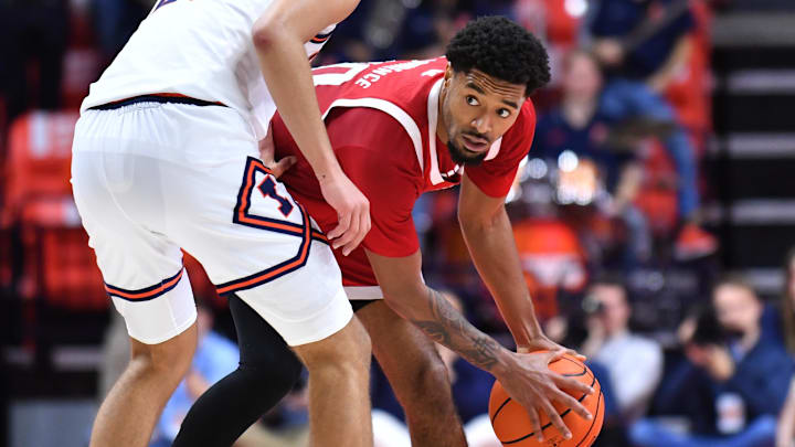 Nebraska Cornhuskers guard Jamarques Lawrence looks around Illinois Fighting Illini guard Keaton Wagler. Nebraska Cornhuskers guard Jamarques Lawrence looks around Illinois Fighting Illini guard Keaton Wagler.