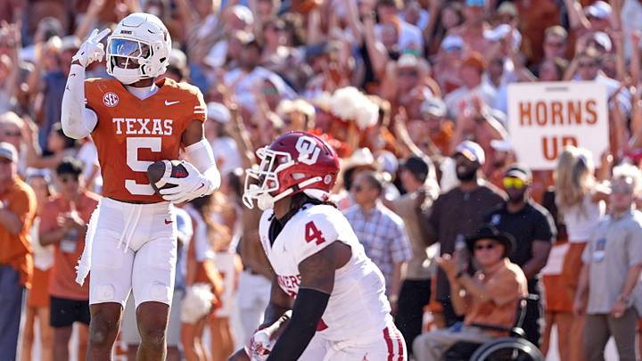 Texas Longhorns defensive back Malik Muhammad (5) celebrates an interception Texas Longhorns defensive back Malik Muhammad (5) celebrates an interception