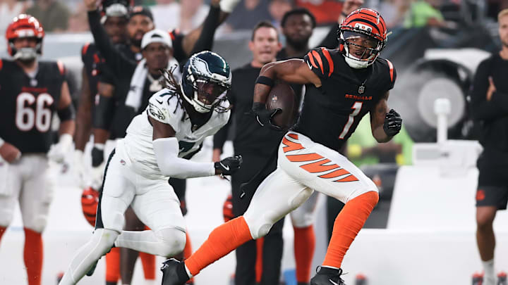 Aug 7, 2025; Philadelphia, Pennsylvania, USA; Cincinnati Bengals wide receiver Ja'Marr Chase (1) runs for a touchdown past Philadelphia Eagles cornerback Kelee Ringo (7) after a catch during the first quarter at Lincoln Financial Field. Mandatory Credit: Bill Streicher-Imagn Images