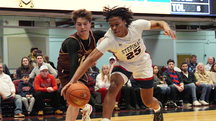 Stepinac's Jasiah Jervis (25) and Iona's Joe Wolf (11) battle for a loose ball during the Crusader Classic at the Westchester County Center in White Plains Jan. 4, 2025. Stepinac's Jasiah Jervis (25) and Iona's Joe Wolf (11) battle for a loose ball during the Crusader Classic at the Westchester County Center in White Plains Jan. 4, 2025.