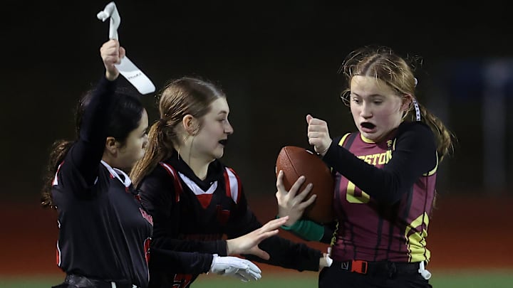 Kingston’s Kamryn Gray gets her flag pulled by a Franklin Pierce defender during the opening round of the District 3 1A/2A Girls Flag Football Tournament at Olympic High School on Friday, Jan. 30, 2026.