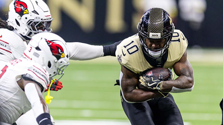 Sep 7, 2025; New Orleans, Louisiana, USA; New Orleans Saints wide receiver Brandin Cooks (10) is tackled by the Arizona Cardinals during the second half at Caesars Superdome. Mandatory Credit: Stephen Lew-Imagn Images