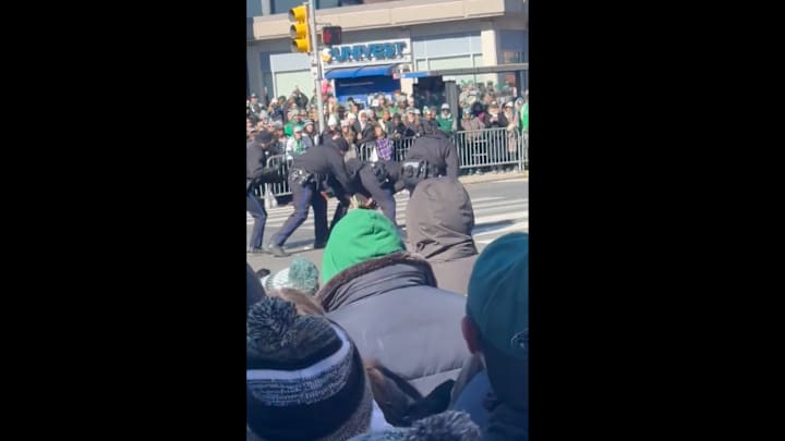 Philadelphia police officers do their rendition of the tush push during the Eagles' Super Bowl parade.