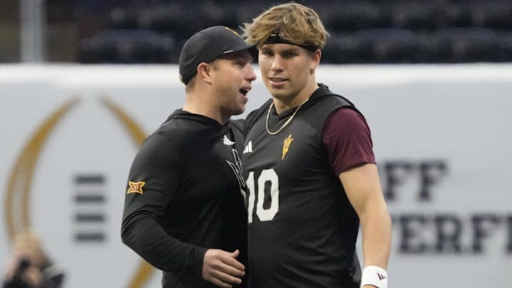 Arizona State quarterback Sam Leavitt (10) is greeted by head coach Kenny Dillingham before playing against Texas in the Chick-fil-A Peach Bowl on Jan 1, 2025, in Atlanta, Ga.