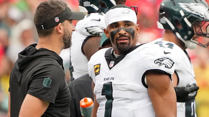 Philadelphia Eagles head coach Nick Sirianni speaks with quarterback Jalen Hurts (1) during the second quarter of the game against the Kansas City Chiefs at GEHA Field at Arrowhead Stadium.