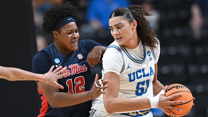 Mar 28, 2025; Spokane, WA, USA; UCLA Bruins center Lauren Betts (51) fights for position against Ole Miss Rebels forward Christeen Iwuala (12). during the first half of a Sweet 16 NCAA Tournament basketball game at Spokane Arena. at Spokane Arena. Mandatory Credit: James Snook-Imagn Images Mar 28, 2025; Spokane, WA, USA; UCLA Bruins center Lauren Betts (51) fights for position against Ole Miss Rebels forward Christeen Iwuala (12). during the first half of a Sweet 16 NCAA Tournament basketball game at Spokane Arena. at Spokane Arena. Mandatory Credit: James Snook-Imagn Images