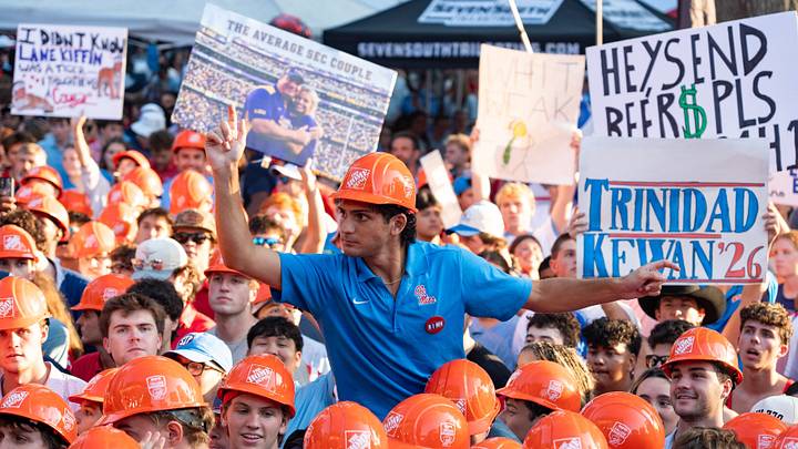A fan and signs are seen during ESPN College GameDay ahead of the Ole Miss-LSU game in The Grove in Oxford, Miss., on Saturday, Sept. 19, 2026.