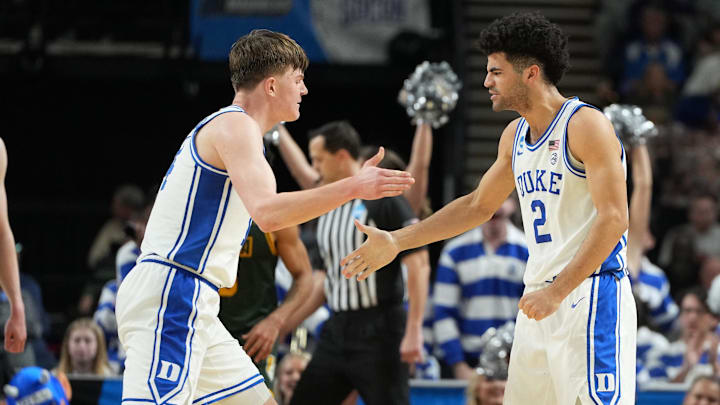Mar 19, 2026; Greenville, SC, USA; Duke Blue Devils guard Cayden Boozer (2) reacts against the Siena Saints in the second half during a first round game of the men's 2026 NCAA Tournament at Bon Secours Wellness Arena. Mandatory Credit: Bob Donnan-Imagn Images