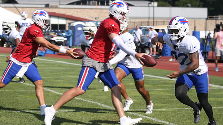 Bills quarterback Josh Allen hands off to running back Ray Davis during position drills during day five of Buffalo Bills training camp at St. John Fisher University Monday, July 28, 2025 in Pittsford, NY.