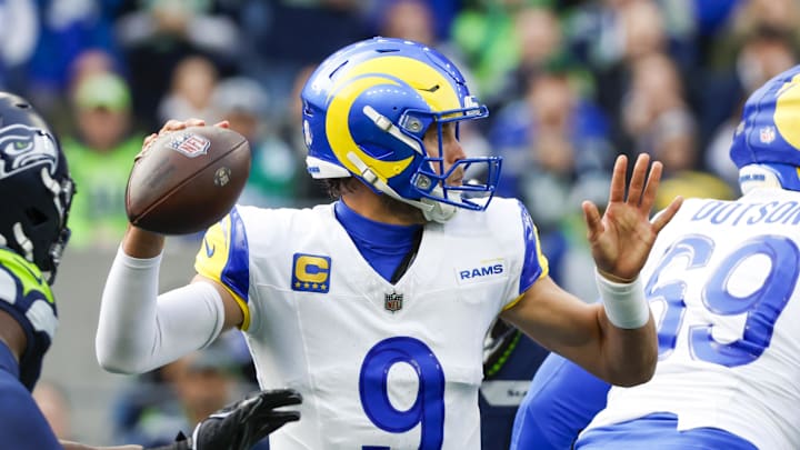 Nov 3, 2024; Seattle, Washington, USA; Los Angeles Rams quarterback Matthew Stafford (9) passes against the Seattle Seahawks during the first quarter at Lumen Field. Mandatory Credit: Joe Nicholson-Imagn Images