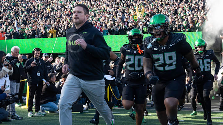 Oregon coach Dan Lanning leads his team onto the field for their game against Southern California Nov. 22, 2025.