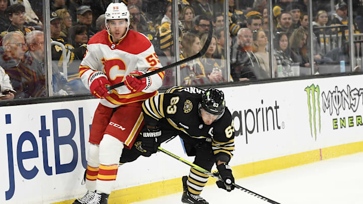 Feb 6, 2024; Boston, Massachusetts, USA; Calgary Flames defenseman Noah Hanifin (55) clears the puck