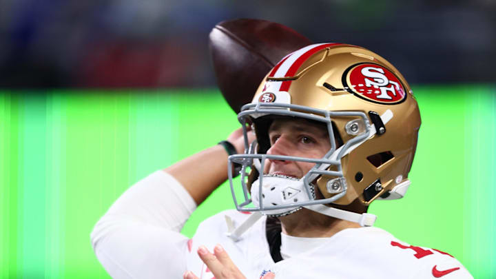San Francisco 49ers quarterback Brock Purdy warms up before the start of the second half. San Francisco 49ers quarterback Brock Purdy warms up before the start of the second half.