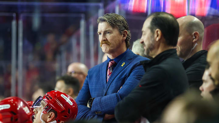 Jan 23, 2025; Calgary, Alberta, CAN; Calgary Flames interim assistant coach Trent Cull on his bench against the Buffalo Sabres during the second period at Scotiabank Saddledome. Mandatory Credit: Sergei Belski-Imagn Images