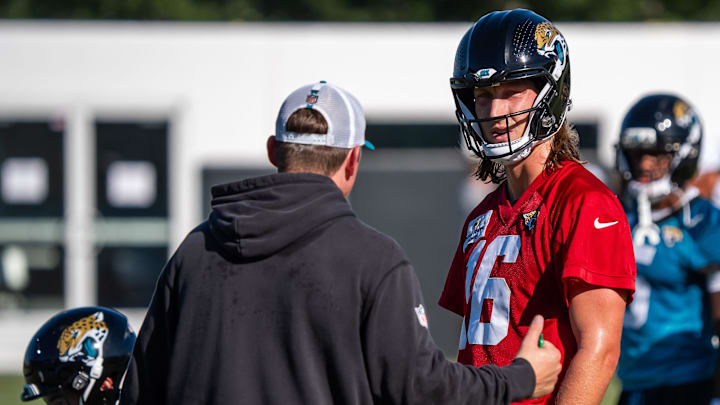 Jacksonville Jaguars offensive coordinator Grant Udinski talks with Jacksonville Jaguars quarterback Trevor Lawrence (16) between drills during an NFL training camp second session at the Miller Electric Center, Thursday, July 24, 2025, in Jacksonville, Fla. [Doug Engle/Florida Times-Union]