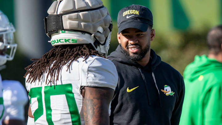 New Oregon running backs coach Ra’Shaad Samples talks with running back Jordan James during practice with the Oregon Ducks on Tuesday, April 9, 2024, at the Hatfield-Dowlin Complex in Eugene, Ore.