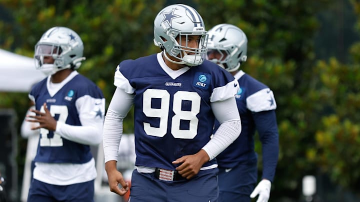 Dallas Cowboys defensive end Payton Turner (98) goes through a drill during practice at the Ford Center at the Star Training Facility in Frisco, Texas.