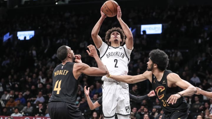 Mar 23, 2023; Brooklyn, New York, USA; Brooklyn Nets forward Cameron Johnson (2) shoots over Cleveland Cavaliers forward Evan Mobley (4) and center Jarrett Allen (31) in the third quarter at Barclays Center. Mandatory Credit: Wendell Cruz-USA TODAY Sports Mar 23, 2023; Brooklyn, New York, USA; Brooklyn Nets forward Cameron Johnson (2) shoots over Cleveland Cavaliers forward Evan Mobley (4) and center Jarrett Allen (31) in the third quarter at Barclays Center. Mandatory Credit: Wendell Cruz-USA TODAY Sports