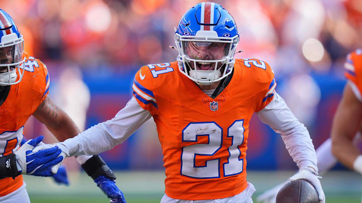Oct 6, 2024; Denver, Colorado, USA; Denver Broncos cornerback Riley Moss (21) celebrates his interception in the second half against the Las Vegas Raiders at Empower Field at Mile High. Oct 6, 2024; Denver, Colorado, USA; Denver Broncos cornerback Riley Moss (21) celebrates his interception in the second half against the Las Vegas Raiders at Empower Field at Mile High.