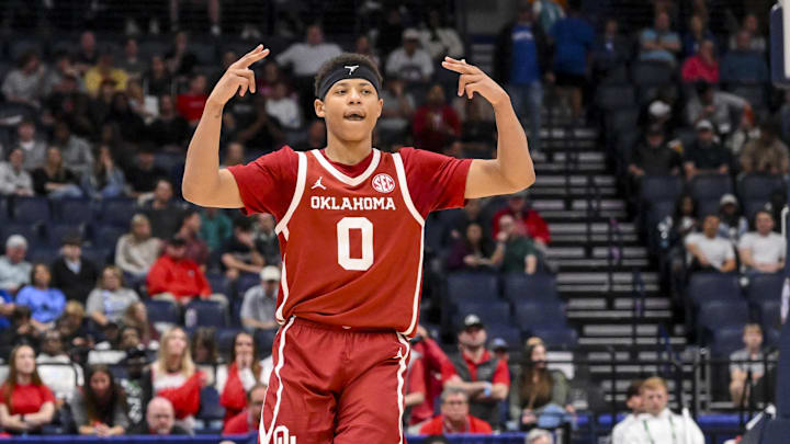 Mar 12, 2025; Nashville, TN, USA;  Oklahoma Sooners guard Jeremiah Fears (0) reacts after a three point basket  against the Georgia Bulldogs during the second half at Bridgestone Arena. Mandatory Credit: Steve Roberts-Imagn Images