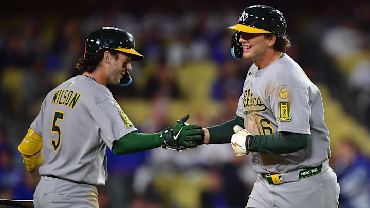 May 13, 2025; Los Angeles, California, USA; Athletics first baseman Nick Kurtz (16) is greeted by shortstop Jacob Wilson (5) after hitting a solo home run against the Los Angeles Dodgers during the eighth inning at Dodger Stadium. Mandatory Credit: Gary A. Vasquez-Imagn Images May 13, 2025; Los Angeles, California, USA; Athletics first baseman Nick Kurtz (16) is greeted by shortstop Jacob Wilson (5) after hitting a solo home run against the Los Angeles Dodgers during the eighth inning at Dodger Stadium. Mandatory Credit: Gary A. Vasquez-Imagn Images