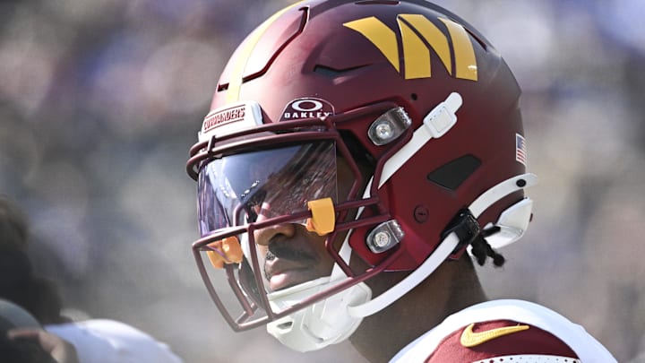 Oct 13, 2024; Baltimore, Maryland, USA; Washington Commanders quarterback Jayden Daniels (5) stands on the sidelines during the second half against the Baltimore Ravens at M&T Bank Stadium. Mandatory Credit: Tommy Gilligan-Imagn Images Oct 13, 2024; Baltimore, Maryland, USA; Washington Commanders quarterback Jayden Daniels (5) stands on the sidelines during the second half against the Baltimore Ravens at M&T Bank Stadium. Mandatory Credit: Tommy Gilligan-Imagn Images