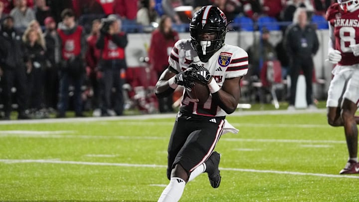 Texas Tech's J'Koby Williams (20) runs in for a touchdown during the AutoZone Liberty Bowl between Arkansas and Texas Tech in Memphis, Tenn., on Friday, December 27, 2024.