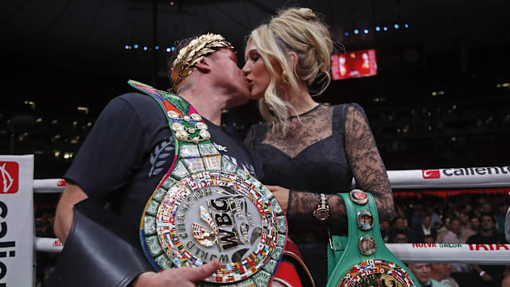 Canelo Alvarez kisses his wife Fernanda Gomez after "The King Coming Home" fight.