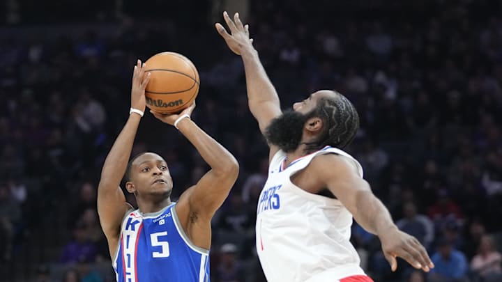 Sacramento Kings guard De'Aaron Fox (5) shoots the basketball against LA Clippers guard James Harden (1) during the first quarter at Golden 1 Center. Mandatory Credit: Kyle Terada-Imagn Images