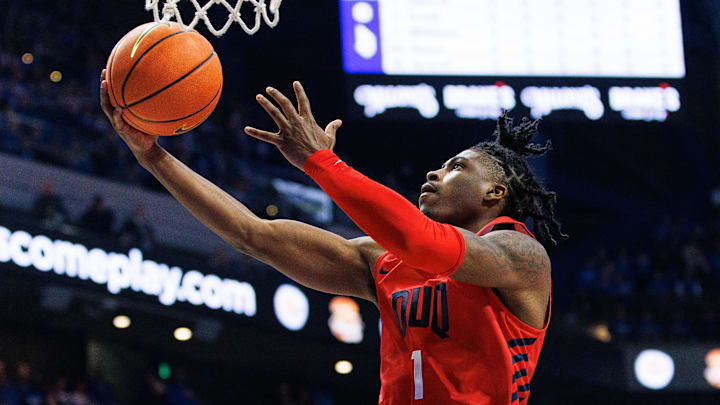 Nov 11, 2022; Lexington, Kentucky, USA; Duquesne Dukes guard Jimmy Clark III (1) goes to the basket