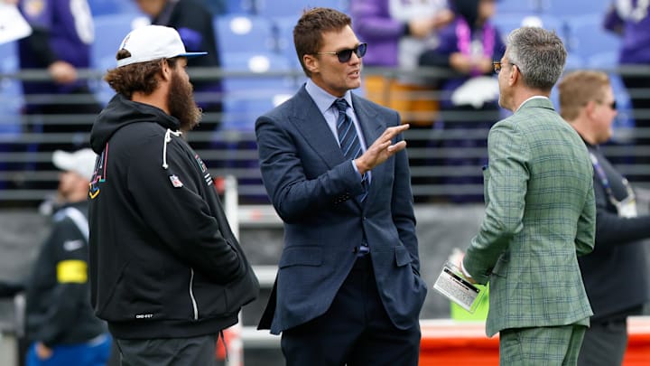 Oct 12, 2025; Baltimore, Maryland, USA; Fox Sports announcer Tom Brady looks on before the game between the Baltimore Ravens and the Los Angeles Rams at M&T Bank Stadium. Mandatory Credit: Peter Casey-Imagn Images