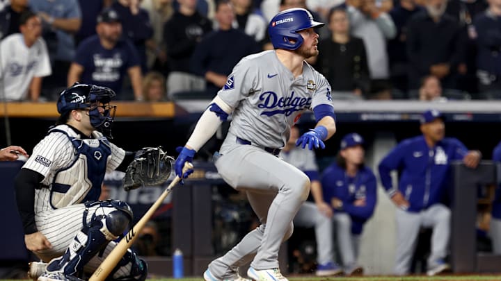 Oct 30, 2024; New York, New York, USA; Los Angeles Dodgers second baseman Gavin Lux (9) hits a RBI sacrifice fly during the eighth inning against the New York Yankees in game five of the 2024 MLB World Series at Yankee Stadium. Mandatory Credit: Vincent Carchietta-Imagn Images